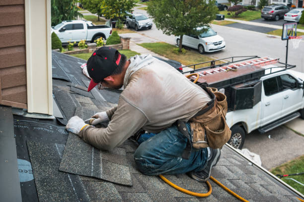 Professional Roofing technician working in Water Mill, NY